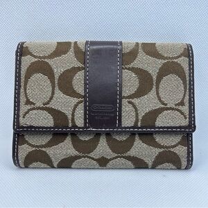 Coach Signature Canvas Tri-fold Wallet.
